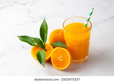 Glass of freshly squeezed orange juice on the table with citrus fruits - Powered by Shutterstock