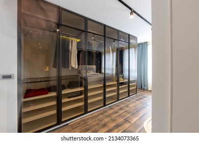 Glass fronted, see through closet in modern apartment