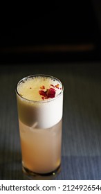 A Glass Of Frothy Drink On A Wooden Bar