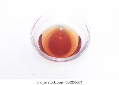 Glass Full Of Red Wine Vinegar, Isolated On White Background