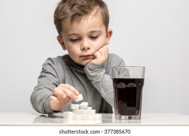 Glass Full Of Soft Drink, Next To It Is The Amount Of Sugar Used In It