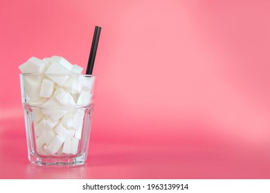 Glass Full With Sugar Cubes With Straw On Pastel Pink And Blue Background With Copy Space, Retro Design, Sweets,candy,soda,unhealthy Eating Concept. Modern Design Colorful