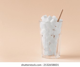 Glass Full Of Sugar Cubes. Unhealthy Food And Drink Concept. Concept Of Too Much Sugar In Drinks.