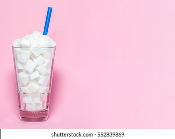 Glass full of sugar cubes - unhealthy diet concept.
