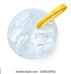 Glass Of Gin And Tonic With Slice Of Lemon Isolated On White Background. Top View