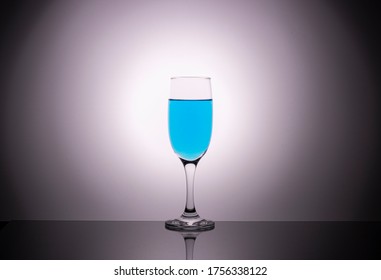 glass glasses and blue wine beautiful gradient background  creative photo glassware for alcoholic beverages