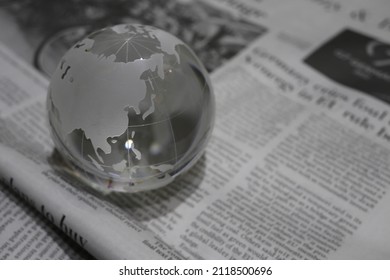 Glass Globe(Asia And Oceania) On  Newspapers