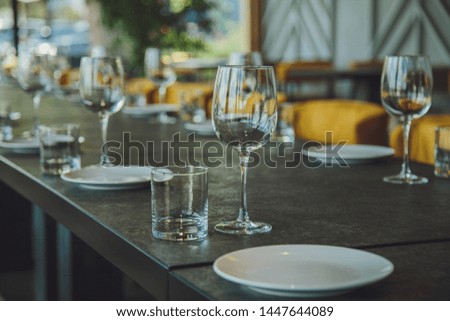 Glass goblets on the table. Served table. Table setting