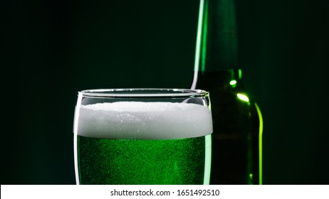 Glass Of Green Beer And Bottle. St. Patrick's Day Concept.