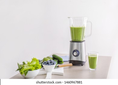 Glass of healthy smoothie, blender and ingredients on table - Powered by Shutterstock - Get 15% off with code: PIKWIZARD15