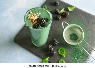 Glass Of Healthy Spirulina Smoothie On Table