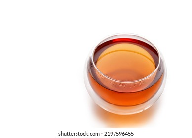 Glass of herbal tea isolated on white background with clipping path. Double Wall Glass Cup with tea. Copy space.