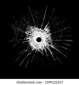 glass with a hole and cracks isolated on a black background