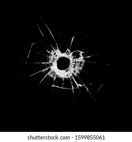 glass with a hole and cracks isolated on a black background