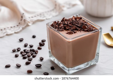 Glass Of Homemade Coffee Mousse With Dark Chocolate Crumbs On White Background.