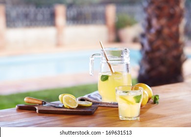 Glass Of Homemade Lemonade In A Poolside Bar
