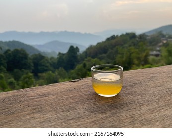 Glass Of Honey Tea And Mountain View In Thailand.