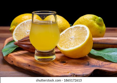 Glass Of Ice Cold Sweet Limoncello Liqueur Made From New Harvest Of Fresh Ripe Yellow Italian Lemons, Amalfi Coast, Italy