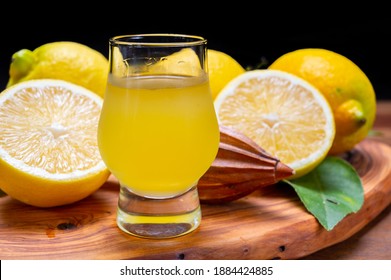 Glass Of Ice Cold Sweet Limoncello Liqueur Made From New Harvest Of Fresh Ripe Yellow Italian Lemons, Amalfi Coast, Italy