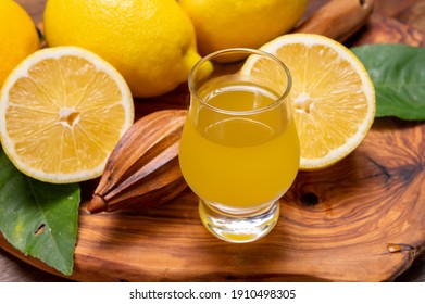 Glass Of Ice Cold Sweet Limoncello Liqueur Made From New Harvest Of Fresh Ripe Yellow Italian Lemons, Amalfi Coast, Italy