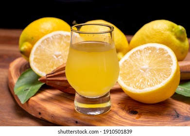 Glass Of Ice Cold Sweet Limoncello Liqueur Made From New Harvest Of Fresh Ripe Yellow Italian Lemons, Amalfi Coast, Italy