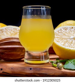 Glass Of Ice Cold Sweet Limoncello Liqueur Made From New Harvest Of Fresh Ripe Yellow Italian Lemons, Amalfi Coast, Italy