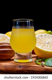 Glass Of Ice Cold Sweet Limoncello Liqueur Made From New Harvest Of Fresh Ripe Yellow Italian Lemons, Amalfi Coast, Italy