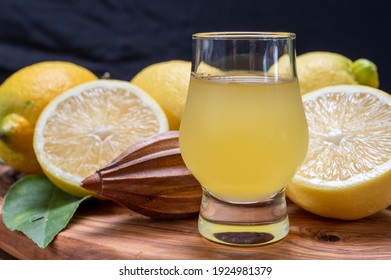 Glass Of Ice Cold Sweet Limoncello Liqueur Made From New Harvest Of Fresh Ripe Yellow Italian Lemons, Amalfi Coast, Italy