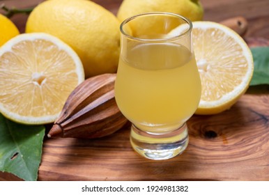 Glass Of Ice Cold Sweet Limoncello Liqueur Made From New Harvest Of Fresh Ripe Yellow Italian Lemons, Amalfi Coast, Italy