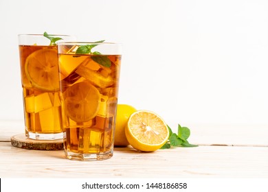glass of ice lemon tea with mint