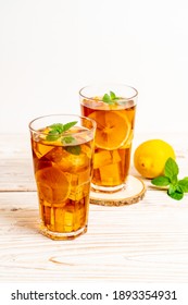 glass of ice lemon tea with mint