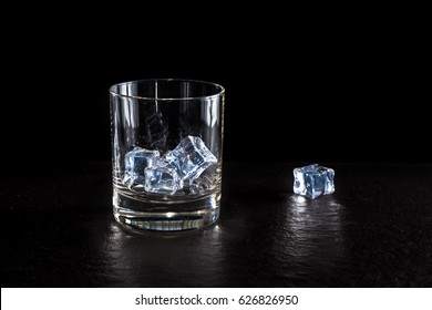 Glass With Ice On A Dark Background