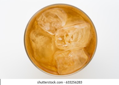 Glass Of Ice Tea Isolated On White Background. From Top View