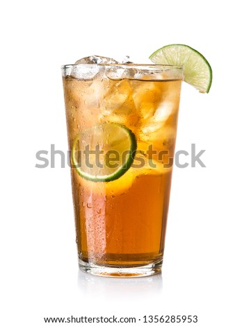 Glass of ice tea with lime on white background