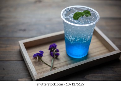 glass of Iced blue hawaii soda on table