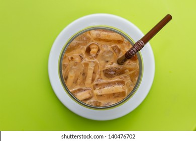 Glass With Iced Coffee Above View On Green Background