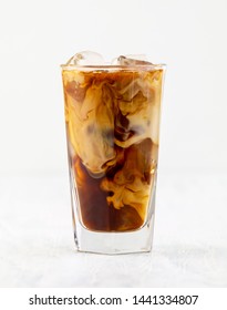 Glass Of Iced Coffee With Milk On White Background