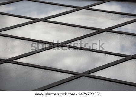 Glass and iron texture background, showcasing industrial aesthetic and modern architectural elements in photography.