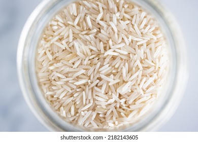 Glass Jar With Basmati Rice Close-up Shot From Top Down Perspective, Healthy Pantry Ingredients And Staples