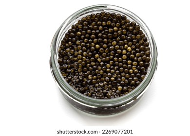 Glass jar of black caviar isolated over white. Natural sturgeon luxury delicacy closeup. Seafood delicatessen appetizer. - Shutterstock ID 2269077201