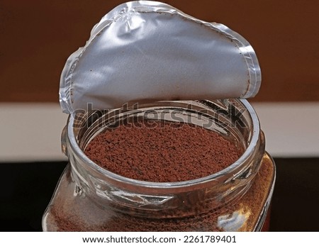 Glass jar containing soluble coffee