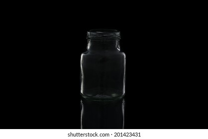 Glass Jar With Empty Threaded On Black Background.