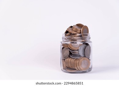 Glass jar filled with indian coins - Powered by Shutterstock