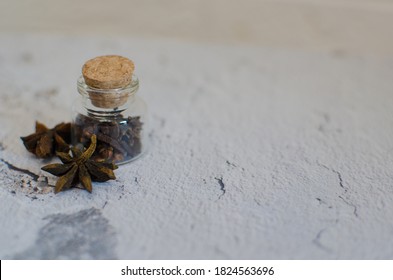 Glass jar filled with scented seasoning, cloves and anise