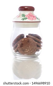 A Glass Jar With Floral Design.  A Jar With Chocolate Chip Cookies.  Delicious Snack Treat For Children. Elegant, Classy And Vintage Cookie Jar. 