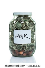 Glass Jar Full Of Money With A White 401k Label