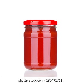 Glass Jar Full Of Tomato Sauce. Isolated On A White Background.