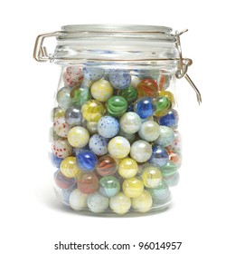 A Glass Jar Is Full Of Various Marbles.