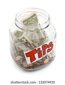 Glass Jar Half Full Of Money With A Tips Label On It, Isolated On A White Background With Drop Shadow.