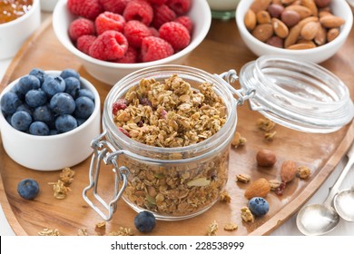 glass jar with homemade granola and berries, top view - Powered by Shutterstock